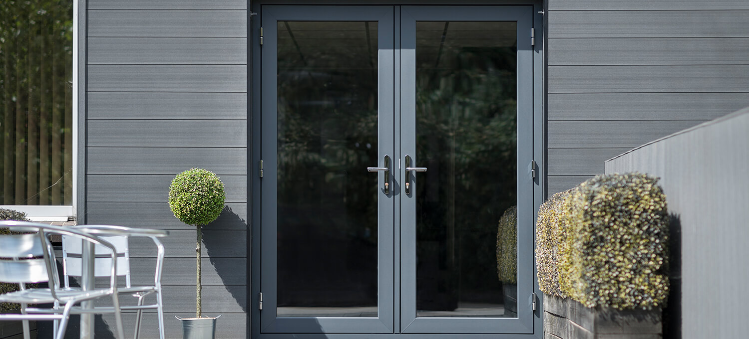 Anthracite grey Deceuninck French doors fitted to a modern grey-clad garden room