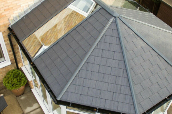 Aerial view of a grey tiled Ultraroof conservatory roof replacement on a brick house